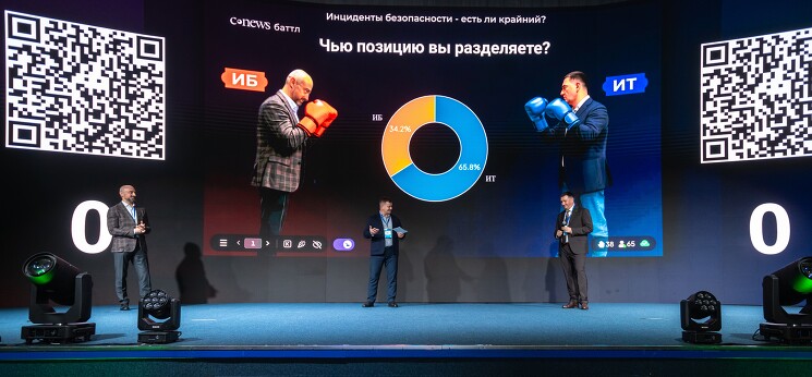 «CNews Баттл»: Вадим Григоренко, заместитель директора департамента информационных технологий Россельхозбанка, руководитель блока инфраструктуры «РСХБ-Интех», и Артём Калашников, управляющий директор Центра информационной безопасности дочерних и зависимых обществ Газпромбанка. Рефери Лев Фисенко, генеральный директор «Кросс технолоджис»